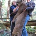 Howard and son Howard Jr with their big Spring Cougar the day after Jr harvested his giant bear.